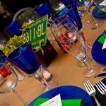 Route 66 table themself with blue goblets, coordinated linens, license plate centerpieces and candles